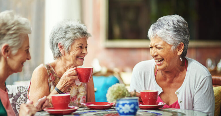 a group of senior women enjoying life together in a senior living community