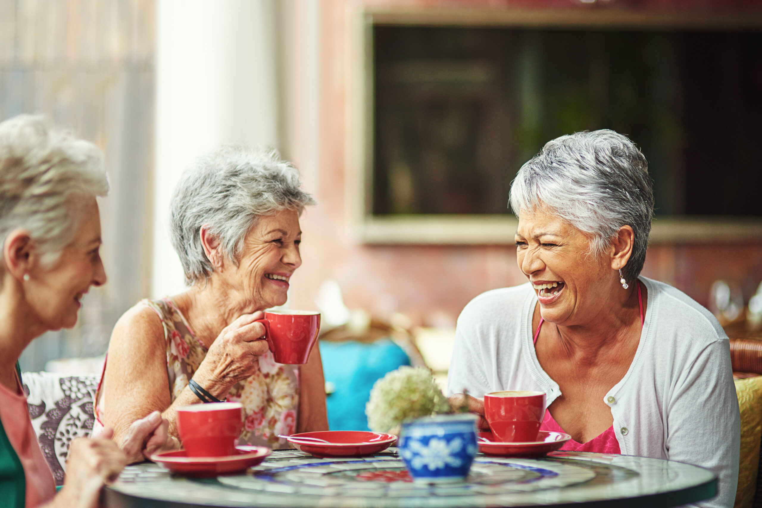 a group of senior women enjoying life together in a senior living community