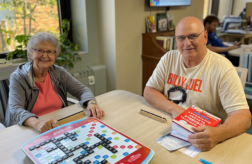 Seniors playing boardgames at Ballard Glenn Independent Living