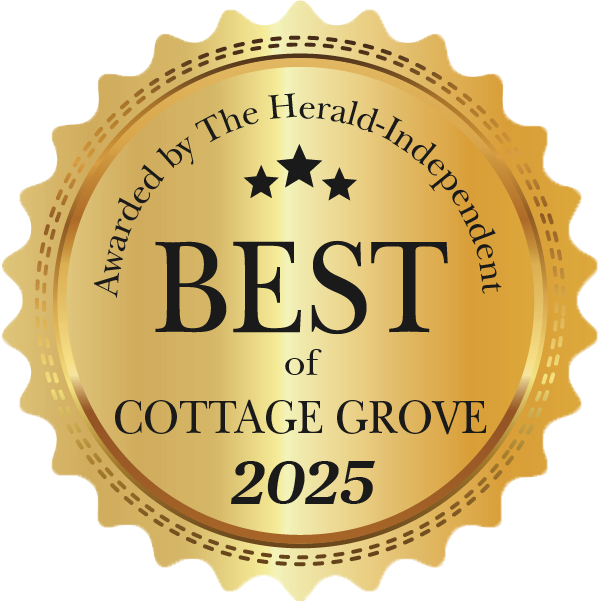 A gold, round seal with scalloped edges reads, Awarded by The Herald-Independent, Best of Cottage Grove 2025, with three black stars above the word BEST.