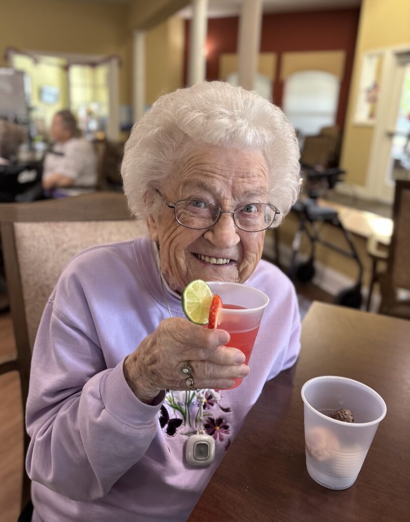 Happy Senior Enjoying a Drink