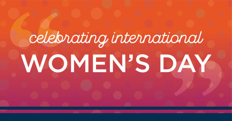 Graphic with an orange and pink gradient background and polka dots, featuring the text celebrating international WOMENS DAY in white bold and cursive fonts.