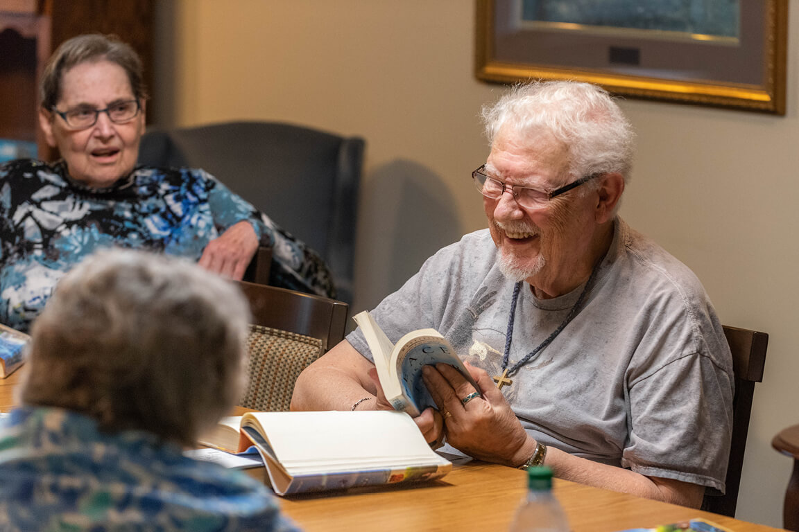 Residents enjoying a book club meeting