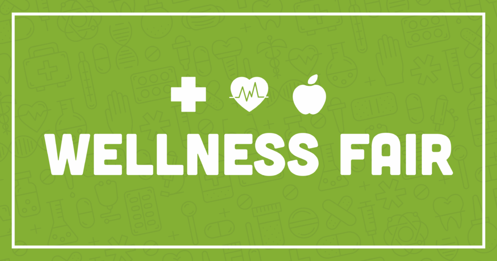 Green graphic with medical and wellness icons as background. White icons of a cross, heart with heartbeat line, and apple are above bold text that reads WELLNESS FAIR. A white border frames the image.