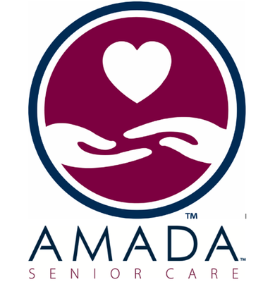 Logo for Amada Senior Care featuring two white hands reaching towards each other under a heart, all within a maroon circle bordered in blue. AMADA SENIOR CARE is written below in navy and red letters.